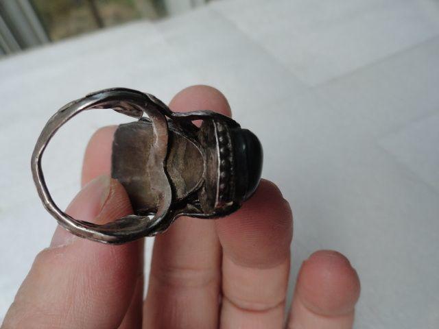 时期精工细制的(祥龙吐珠)龙头镶猫眼黑宝石银