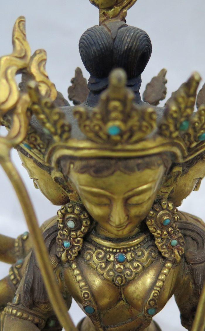 清代的铜鎏金三头六壁佛