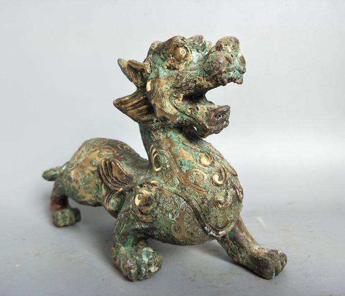 明代错银老器麒麟