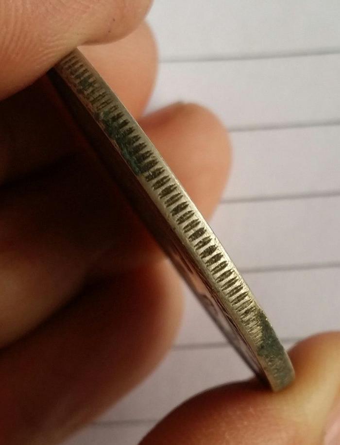     描述:老包浆孙小头银币,边齿