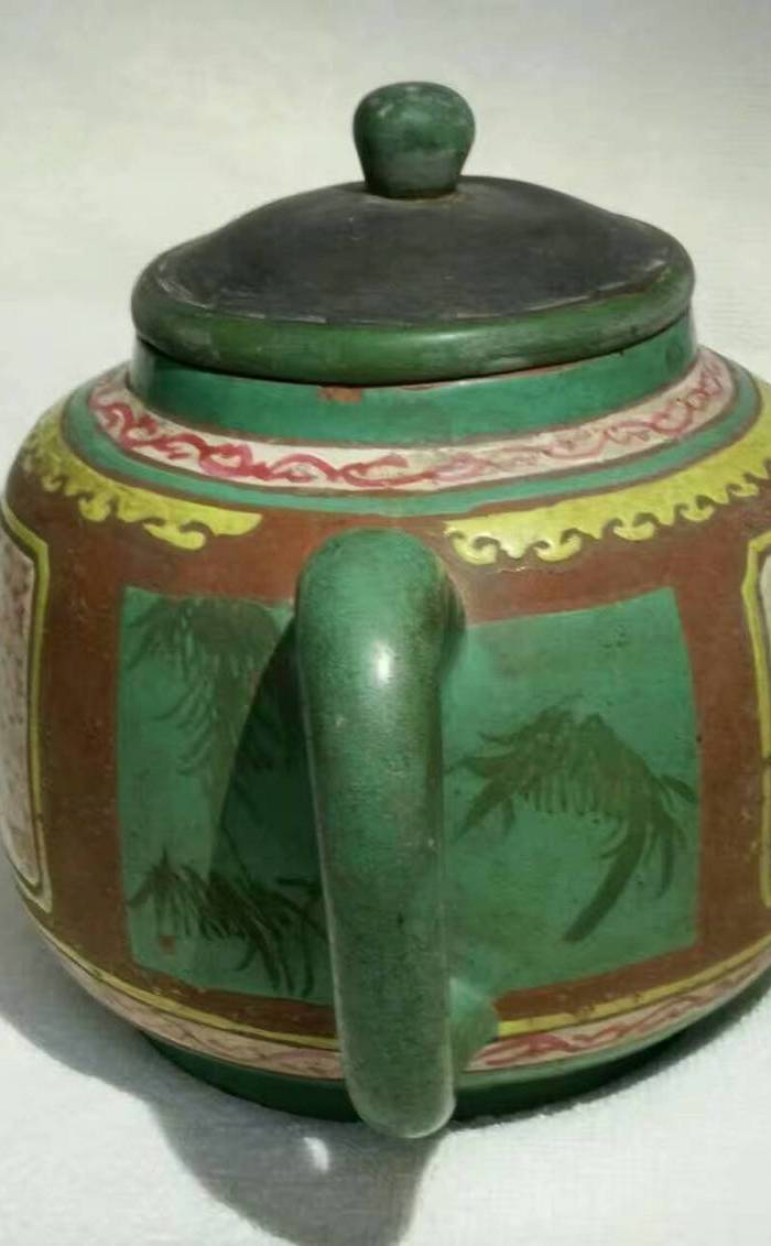 树叶底款端把独眼彩绘紫砂壶