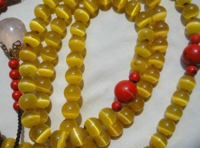     描述:老朝珠黄猫眼项链,108