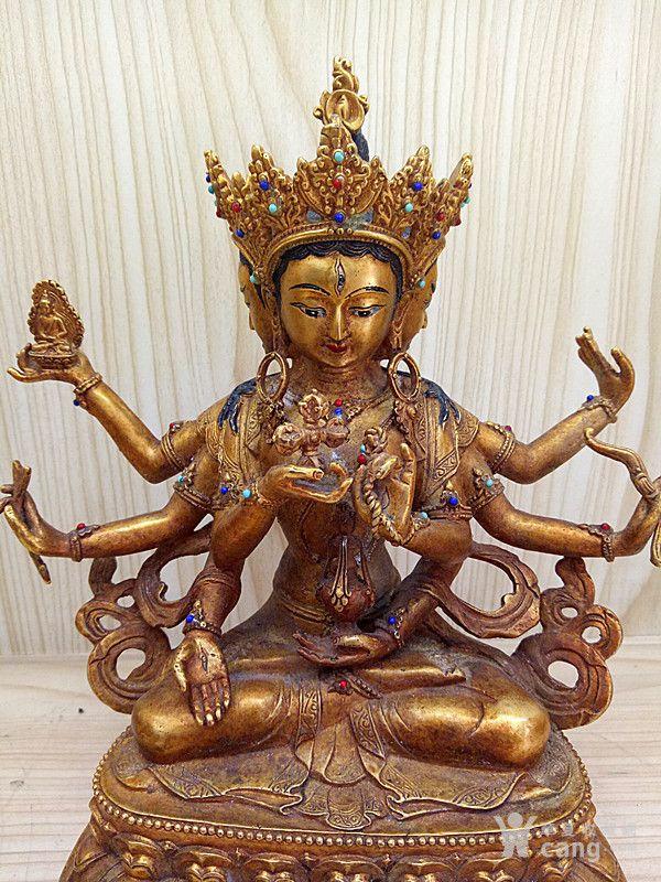 三头六臂鎏金佛