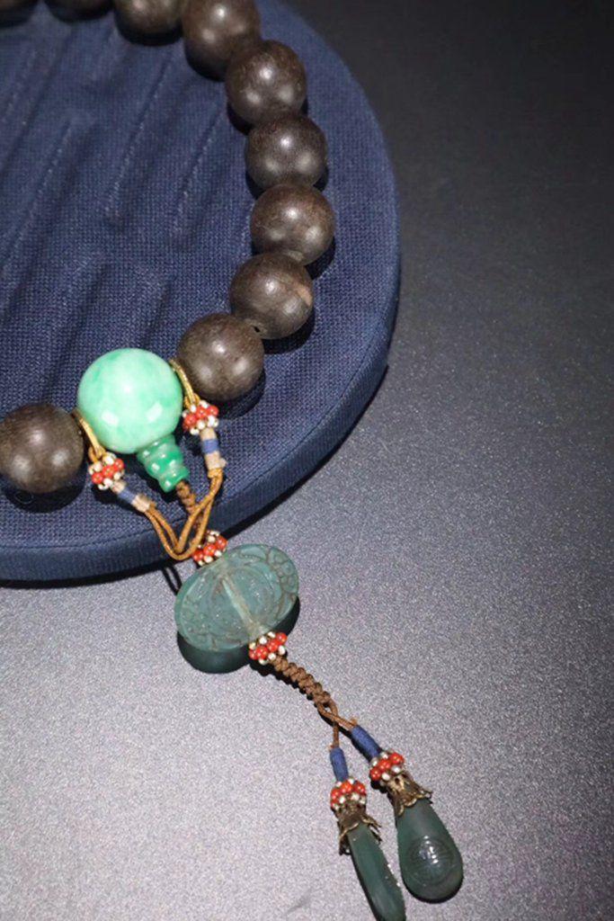 清代: 名贵老沉香18籽手持一串